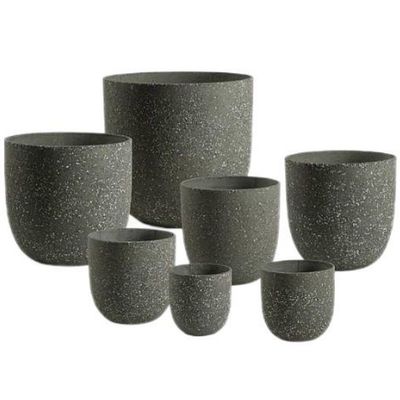 Des pots de jardin en fibre de ciment élégants pour les fleurs / plantes vertes dans le jardin intérieur