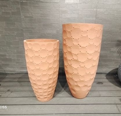 Planteur en fibre d'argile avec surface texturée et trous de drainage