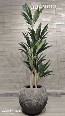 Planteur en argile de fibre ronde à texture grise avec un motif naturel semblable à un rocher